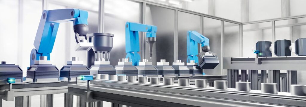 Roboterarme arbeiten in einer modernen Fertigungsstrasse – Automatisierung als Teil des Sondermaschinenbaus